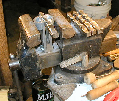chest legs filed and showing vise fixture